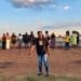 Lwazi Mnisi, a resident of Lawley, leads the prayer at R558 and Walter Road intersection (Image: Viki Stuurman)