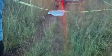 Police forensic services on scene in Ennerdale Ext 9, where a body lies covered at the cordoned-off crime scene (Image: Viki Stuurman)