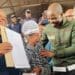City of Johannesburg Executive Mayor Dada Morero and MMC Mlungisi Mabaso share a heartfelt moment with beneficiary TL Maisela, who is overcome with emotion while receiving her title deed (Image: Viki Stuurman)