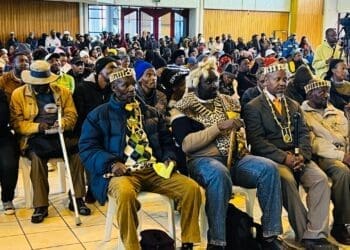 Traditional leaders sit among residents at the packed Lenasia South Civic Centre, attending the IDP (Image: Viki Stuurman)